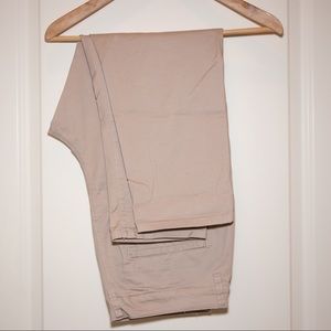 Tan chinos with cropped hem and dropped crotch.